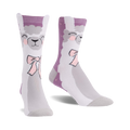 Pair of crew socks showcasing a whimsical llama design.  The socks are primarily grey and light purple with a cute llama face and pink bow.
