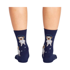 Back view of the socks on a person's legs, highlighting the full astronaut pug design on the back of the socks.