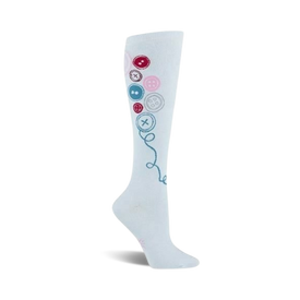 "whimsical knee-high socks adorned with a pattern of colorful buttons connected by a blue thread."   