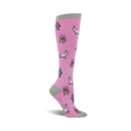 Pink knee-high socks with a whimsical pattern of unicorns, robots, and cupcakes on a light pink background. Grey cuff.