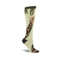 A pair of women's light green knee-high socks with a whimsical giraffe design printed on them.  The giraffe is brown and tan, and there's green foliage at the top.