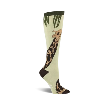  light green knee-high socks with a full-length brown giraffe with dark brown spots, a dark green top, and light green leaves.  