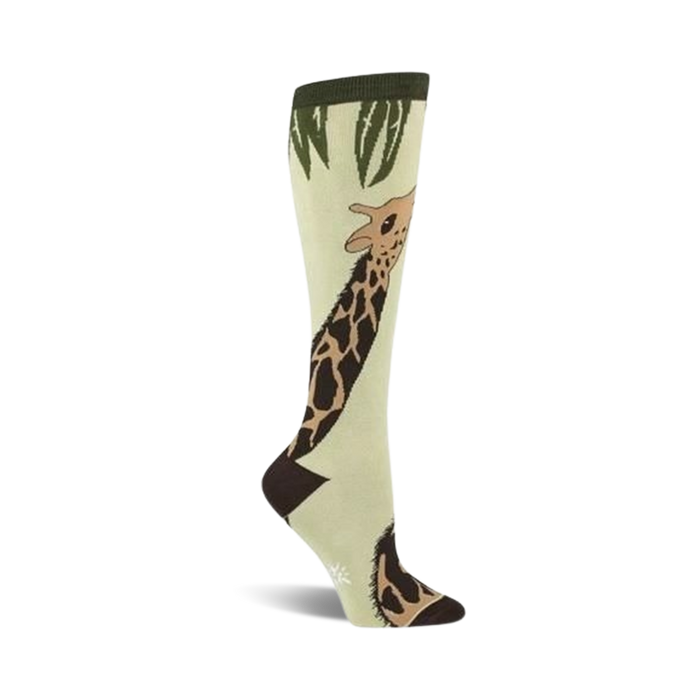  light green knee-high socks with a full-length brown giraffe with dark brown spots, a dark green top, and light green leaves.   }}