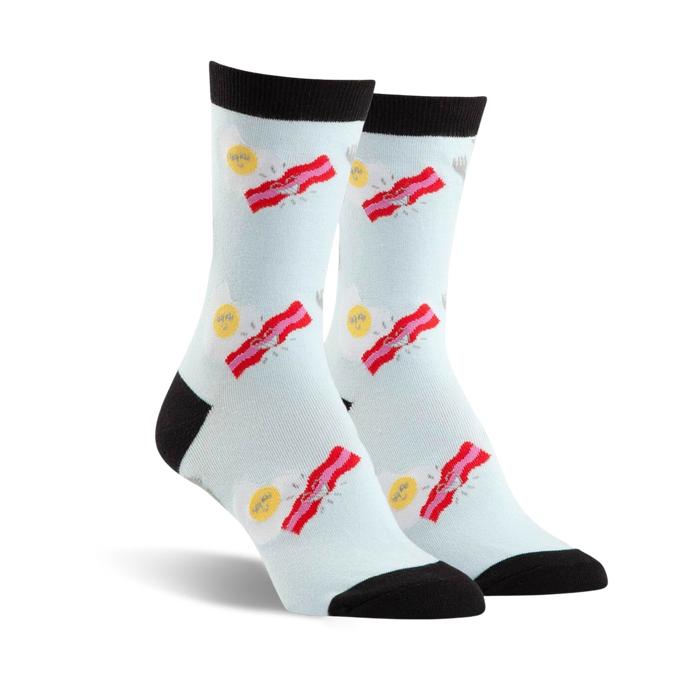 women's blue crew socks featuring stacks of bacon strips by sunny side up eggs, top of sock is black.    }}