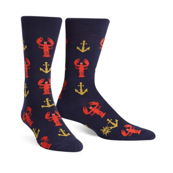 A pair of navy blue crew socks with a fun pattern of red lobsters and gold anchors. 
