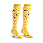 Pair of yellow knee-high socks with a honeycomb pattern and cute bee illustrations.