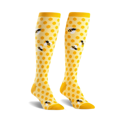 yellow knee-high socks with black bee and honeycomb pattern.  