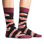 A studio shot of the bacon socks laid flat, showing detail of the design.