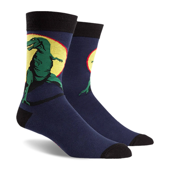 T-Rex socks: Navy blue with a fierce green Tyrannosaurus Rex dinosaur design on a yellow background. Black cuffs, heels, and 