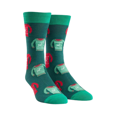 Pair of teal crew socks with a repeating pattern of red and green holiday sweaters featuring reindeer. 