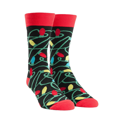 Crew socks with a tangled Christmas lights design.  Main colors are black, red, yellow, green, and blue.