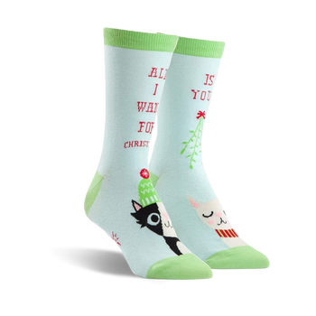  light blue women's crew socks with black and white cats wearing santa hats and mistletoe, words "all i want for christmas is you".  