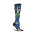 Knee-high socks in navy blue, adorned with a whimsical mermaid wrapped around a yellow anchor. Yellow anchors are scattered across the sock.