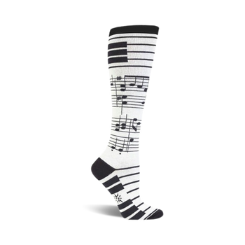 black musical notes and piano keys on a white background add a lively touch to these womens' knee-high socks.  