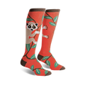 Pair of coral knee-high socks featuring a whimsical slow loris design on a branch with teal leaves. Brown sock top.