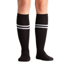 Studio shot: A pair of black knee-high socks with white stripes on a white background.