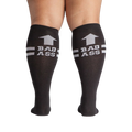Flat lay product shot: Two black 'Bad Ass' knee-high socks laid flat.