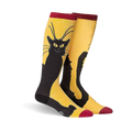 A pair of knee-high socks in mustard yellow with a black cat design. The cat is stylized and sits against the yellow background.