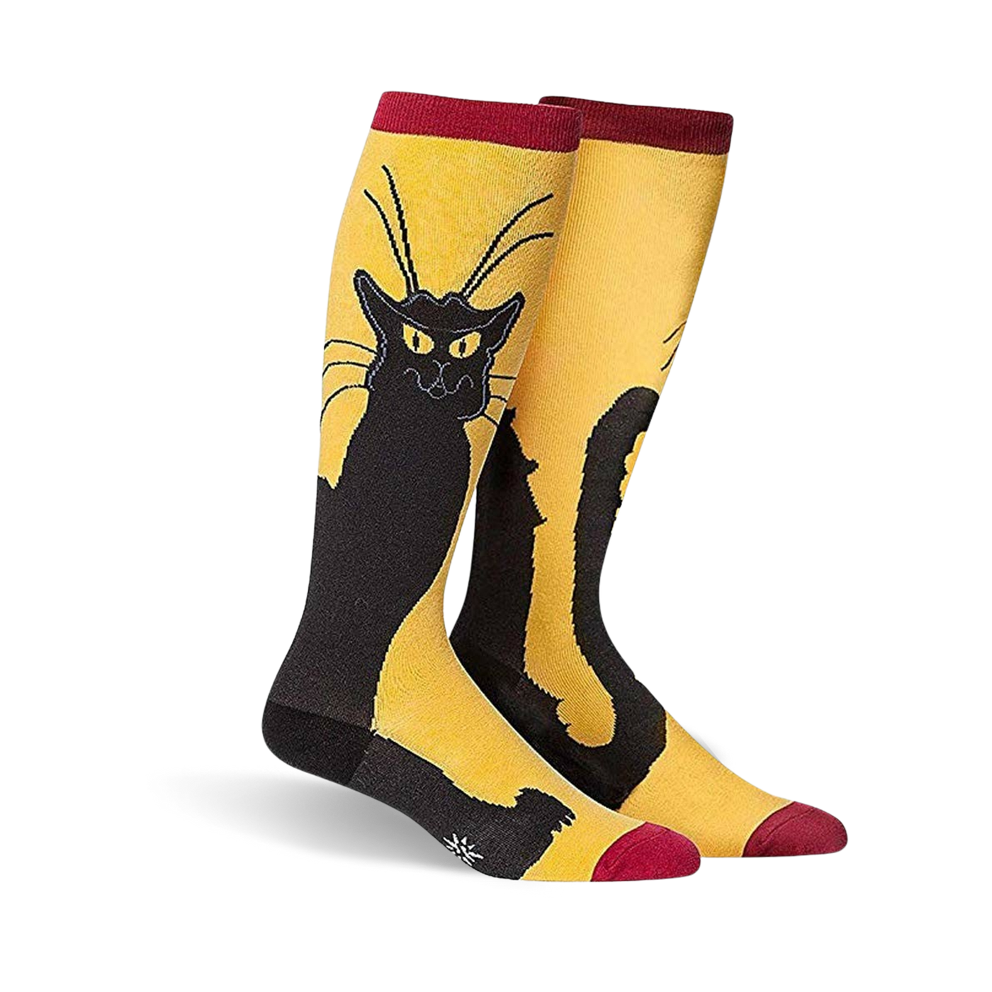 A pair of knee-high socks in mustard yellow with a black cat design. The cat is stylized and sits against the yellow background.