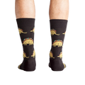 Back view of a person wearing Tacosaurus socks.  The image shows the complete sock design and a hint of the sock's cuff.