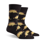 Pair of black crew socks featuring a repeating pattern of tacosaurus illustrations. The tacosaurus is a dinosaur-shaped taco with all the fixings.