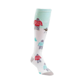 Knee-high socks in white with a teal background. The design features Yetis in red and teal sweaters, a small dog, and tiny trees.
