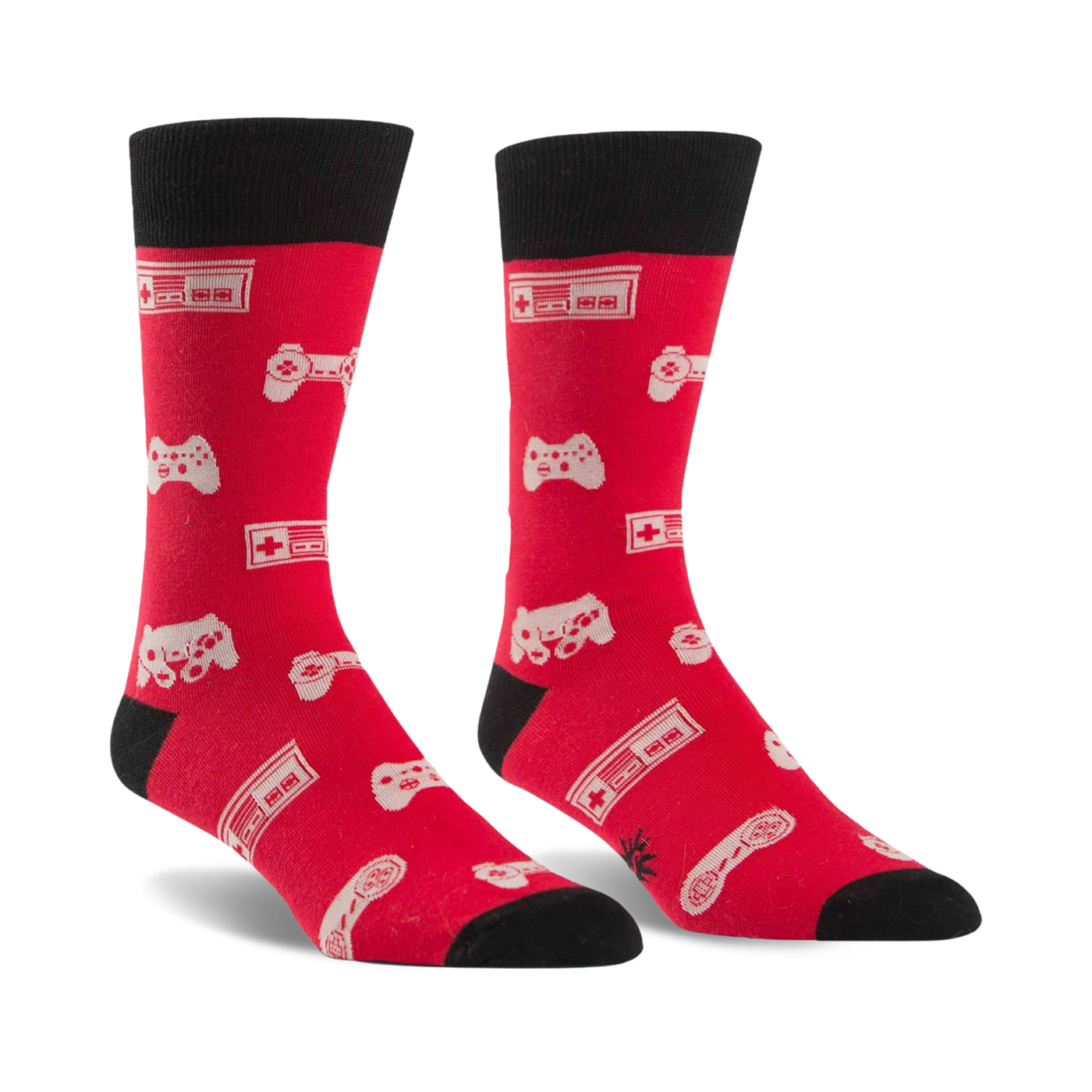 Pair of red crew socks with black cuffs.  Features a pattern of white video game controllers and consoles.