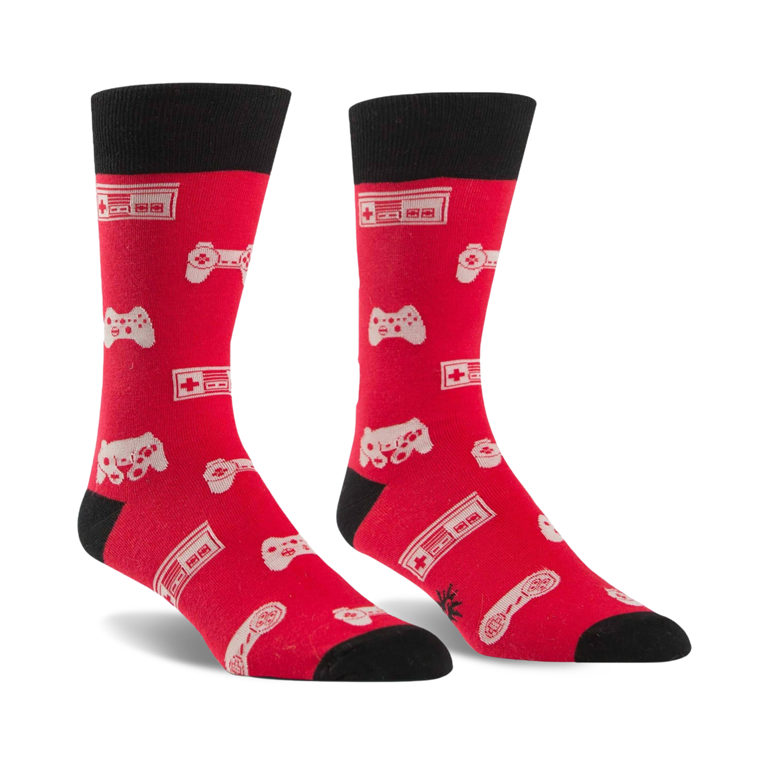 Pair of red crew socks with black cuffs.  Features a pattern of white video game controllers and consoles.