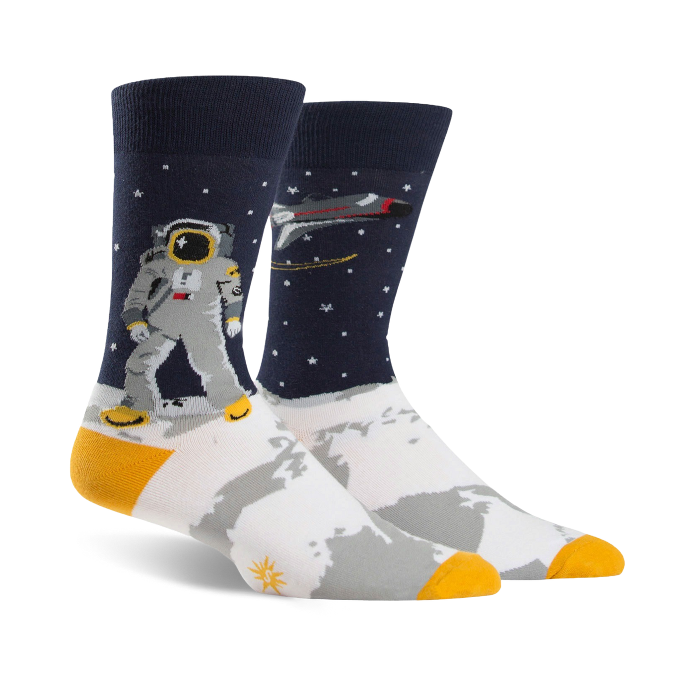 A pair of crew socks; navy blue background with white moon surface, astronaut, rocket, and gold accents.