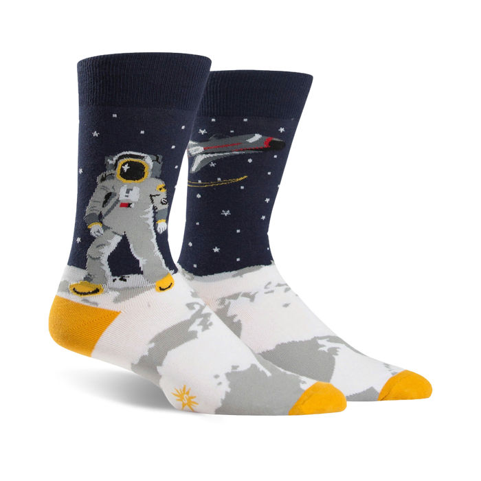 dark blue socks with white toe and heel. astronaut with big head. space suit. planet, moon, stars. mens. ribbed top.    }}