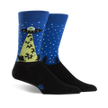 Pair of crew socks in blue with black toes and heels. Features a design of a UFO beaming Santa's sleigh with reindeer.