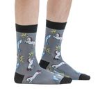 Lifestyle shot: A person modeling the Unicorn vs. Narwhal socks, showing how they look when worn.