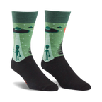 Pair of crew socks in green and black. The design features grey aliens, UFOs, and a starry night scene.