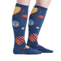Lifestyle shot showing the Planets socks on a person's legs against a white background, from a slightly different angle.