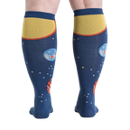 Rear view of a person wearing Planets knee-high socks, showcasing the back design.