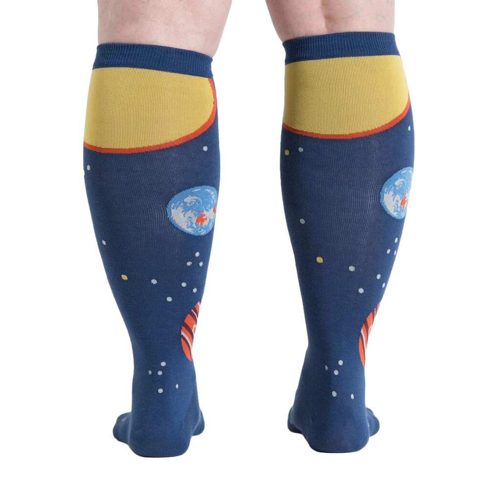 Rear view of a person wearing Planets knee-high socks, showcasing the back design.