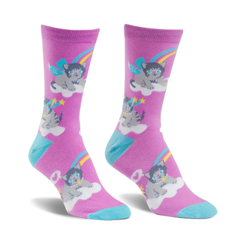 pink socks with a cartoonish pattern of cats wearing party hats and rainbow wings sitting on clouds against a starry and moonlit sky.  