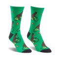 Crew socks in green featuring brown bears wearing top hats riding yellow bicycles.  Small red flowers are scattered on the background.
