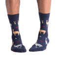 Lifestyle shot:  A person's legs showing off the Llama Drama socks.