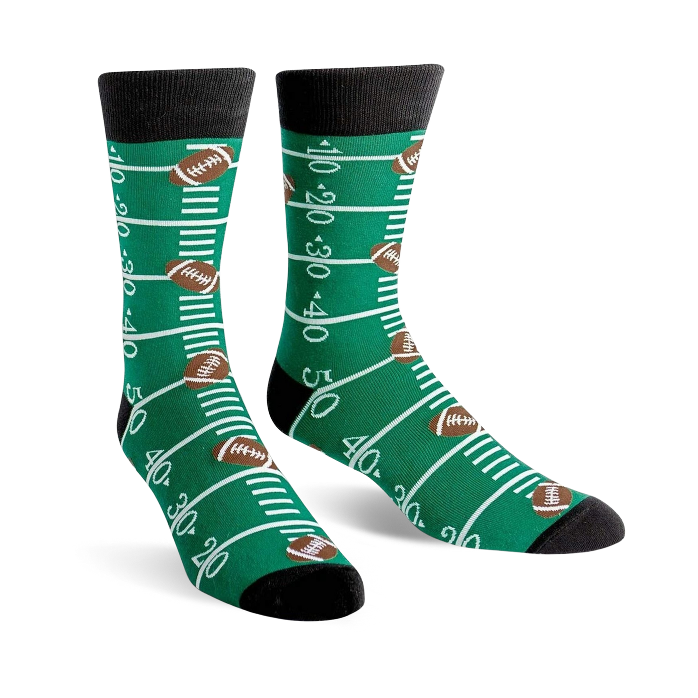 A pair of green crew socks with a football field design, including yard lines and brown footballs. 