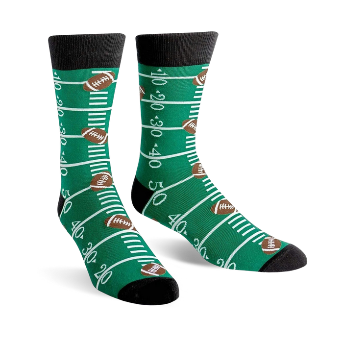 green football field crew socks with white yard markers and brown footballs for men.   }}