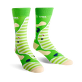 Pair of crew socks showing a golf course design. Green and cream stripes with sand traps, a flag, and golf ball.