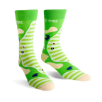 Pair of crew socks showing a golf course design. Green and cream stripes with sand traps, a flag, and golf ball.