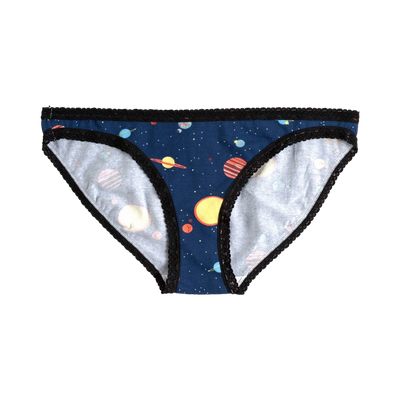 A pair of women's navy blue hipster underwear with a colorful planets and stars print and black lace trim.