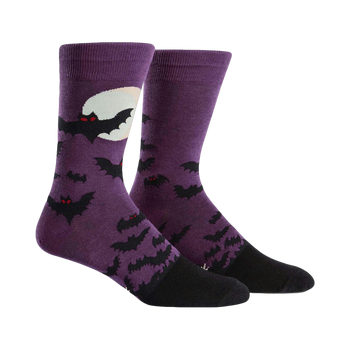 Purple crew socks with a black bat design and a full moon.  Black heel and toe.  Spooky and fun!