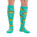 Flat lay of the Tacosaurus knee-high socks on a white background.