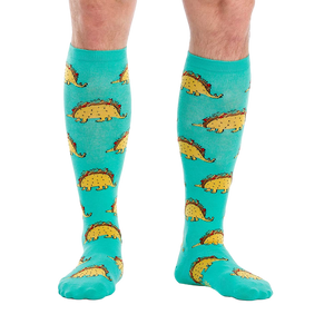 Flat lay of the Tacosaurus knee-high socks on a white background.