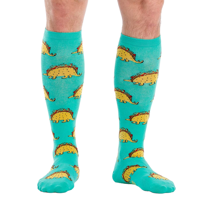 Flat lay of the Tacosaurus knee-high socks on a white background.