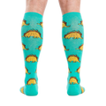 Back view of the Tacosaurus knee-high socks on a person's legs.