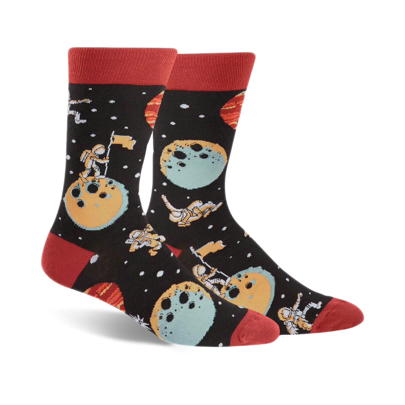 A pair of black crew socks with a space theme. Astronauts, planets, and moons are illustrated in teal, orange, and red.
